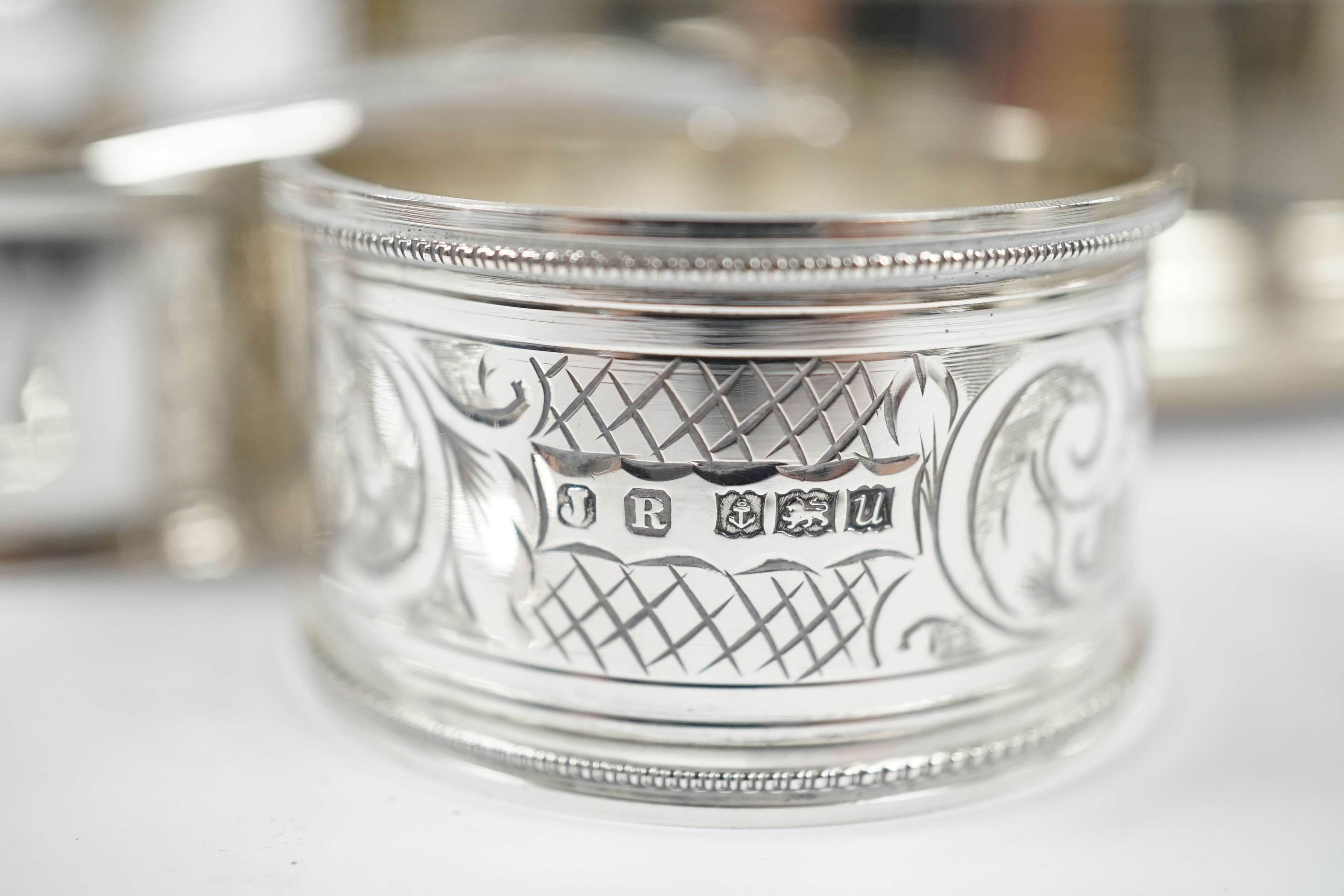 A modern silver mounted wine label and a quantity of sundry small silver including wine labels, small photograph frames, napkin rings, flatware etc. and a plated Guernsey milk can condiment. Condition - fair to good